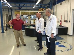 RAMTEC coordinator Ritch Ramey talking with Nissin Reps Andy Hentz and Jeff Johnston and Mark Hardin with Sandvik.